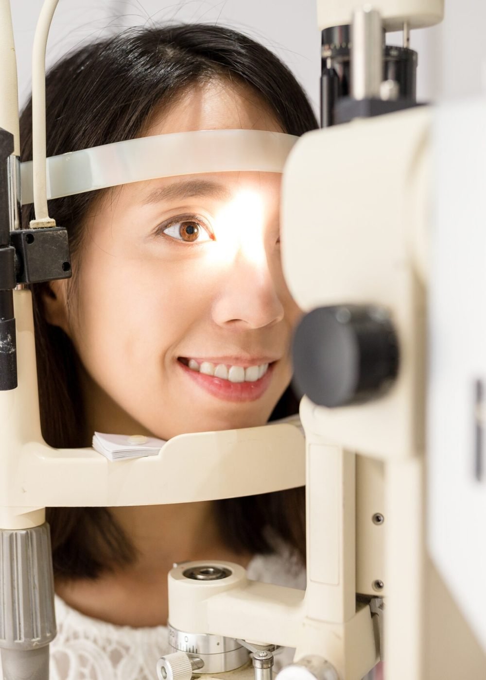 Woman undergo optical exam